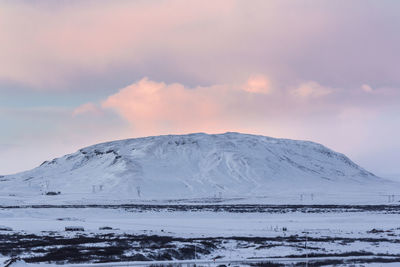 Scenic view of snowcapped mountains against sky during winter