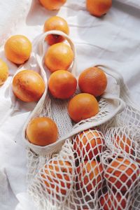 High angle view of orange fruits on table