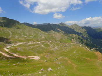 Scenic view of landscape and mountains against sky