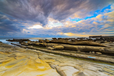 Scenic view of landscape against sky during sunset