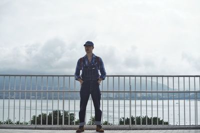 Full length of man standing against sky