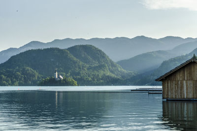 Scenic view of lake and mountains against sky