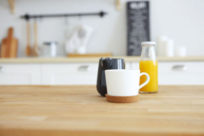 Close-up of coffee cup on table at home