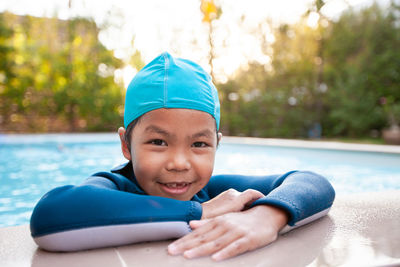 Portrait of smiling girl in swimming pool