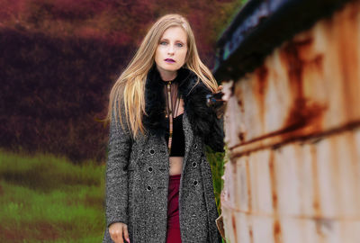 Portrait of beautiful young woman standing outdoors