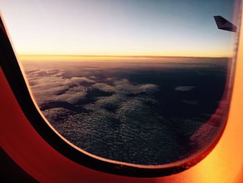 Aerial view of landscape seen through airplane window