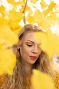 Portrait of smiling woman with yellow eyes