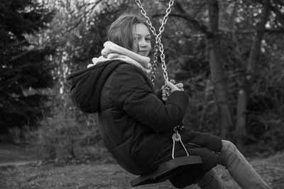 Man sitting on swing