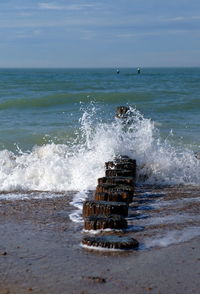 Waves of the sea turn against a breakwater in the netherlands