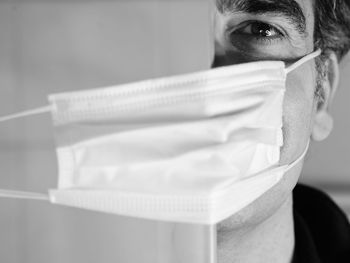 Close-up portrait of man wearing mask