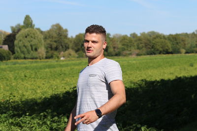 Young man standing on field