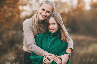 Portrait of a smiling young woman outdoors