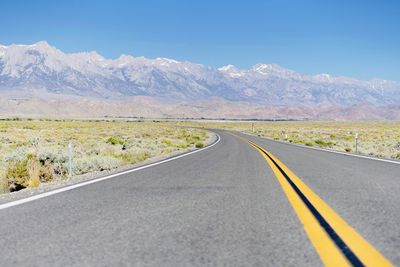 Empty road against sky