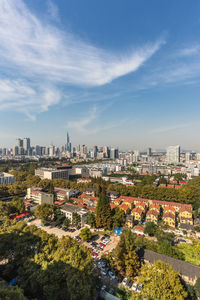 High angle view of buildings in city against sky