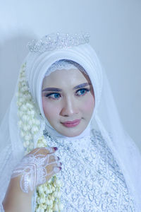 Portrait of young woman wearing hijab