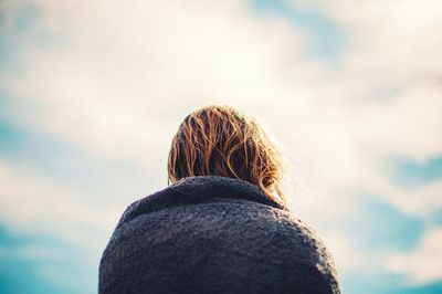 Rear view of woman against sky