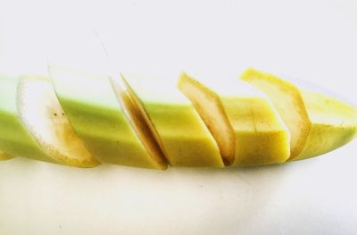 Close-up of chopped fruit against white background