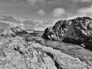 Scenic ocean inlet against rugged rocks. fine art photography.