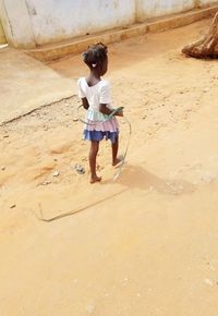 High angle view of girl on sand