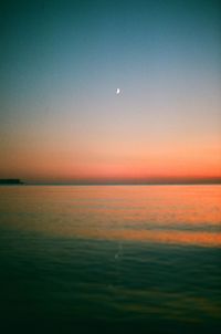 Scenic view of sea against sky at night