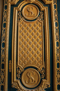 Golden decoration in a gate of the les invalides palace in paris. the famous capital of france.