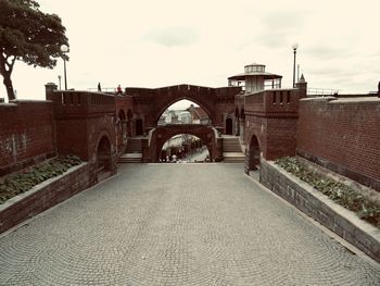 View of bridge against cloudy sky