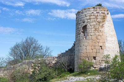 Low angle view of old building against sky