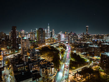 High angle view of illuminated buildings in city at night