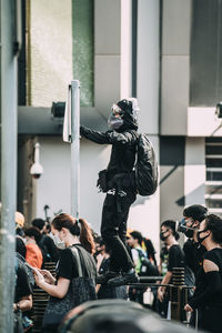 People photographing on street in city