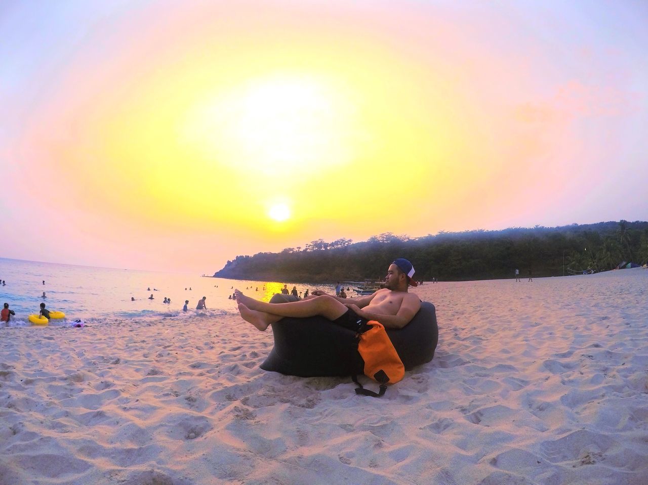 PEOPLE RELAXING ON BEACH