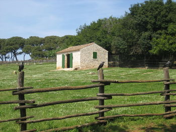 House on field against sky