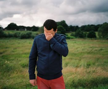 Man standing on grassy field