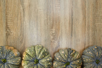 High angle view of pumpkins on wooden table