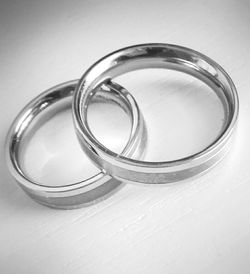 Close-up of wedding rings on table