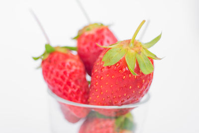 Close-up of strawberry over white background