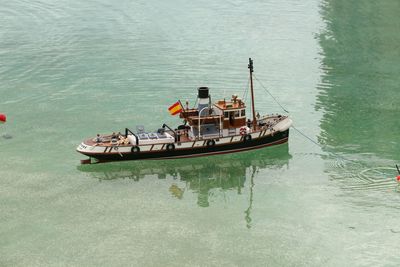 High angle view of spanish flag on boat moored over sea