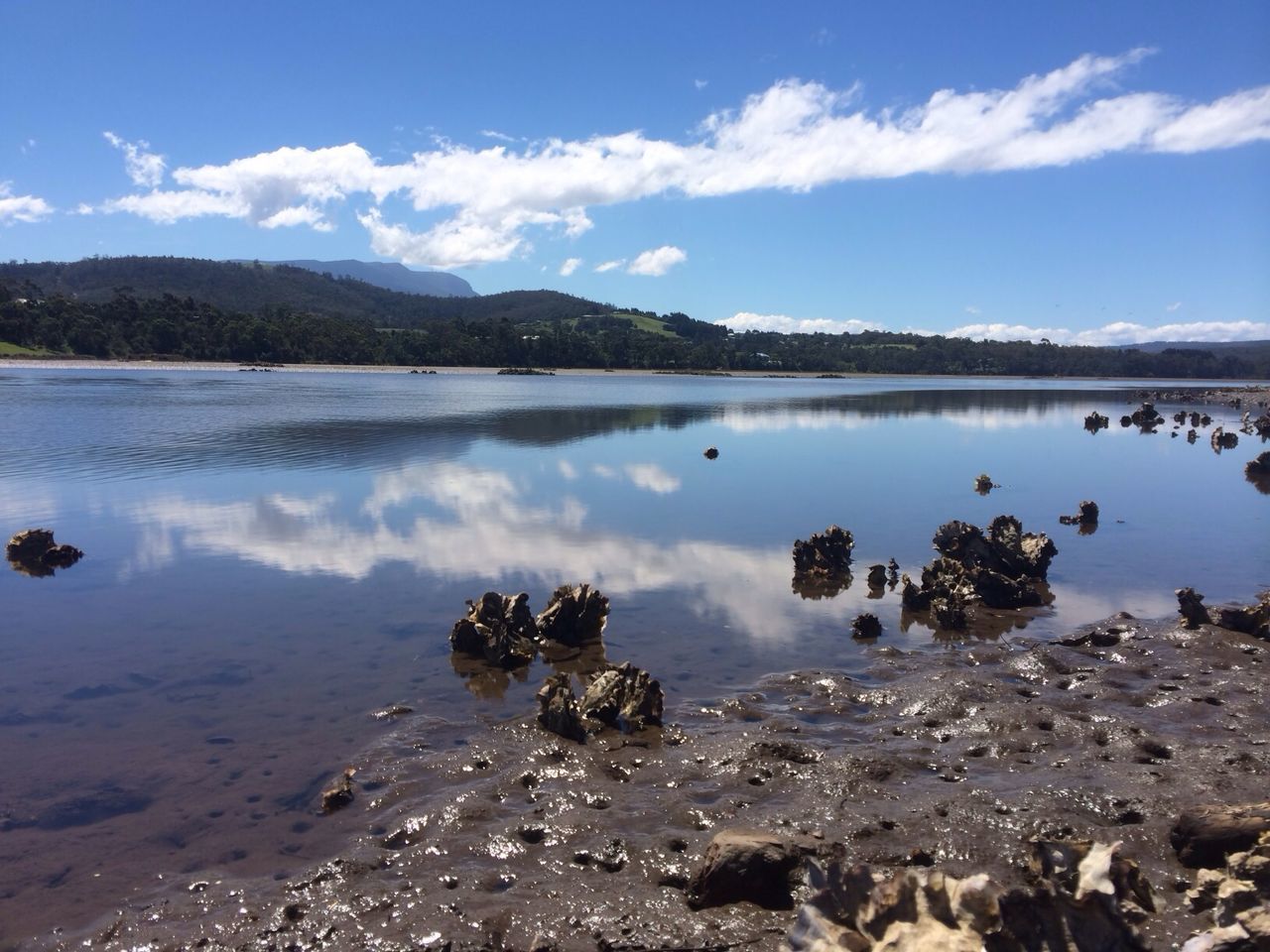 water, sky, tranquil scene, tranquility, scenics, lake, cloud - sky, reflection, beauty in nature, mountain, nature, cloud, blue, beach, shore, idyllic, lakeshore, calm, day, rock - object