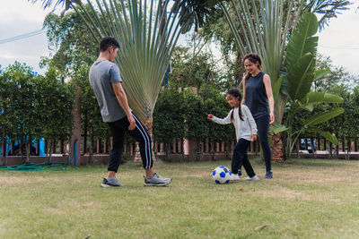 Full length of family playing in park