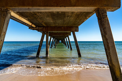 Pier over sea against sky