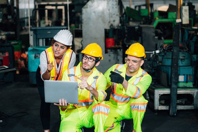 Engineers looking away in factory