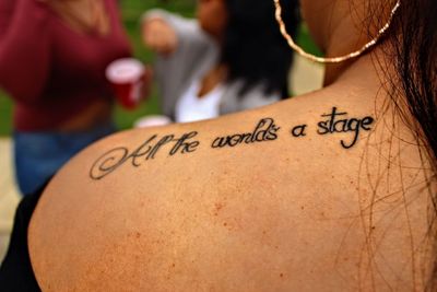 Cropped image of woman with tattoo on shoulder