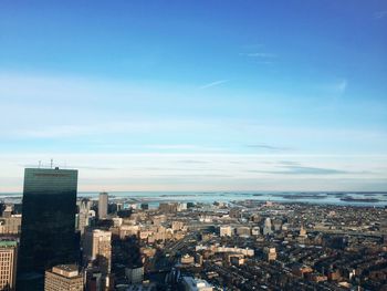 View of cityscape against blue sky