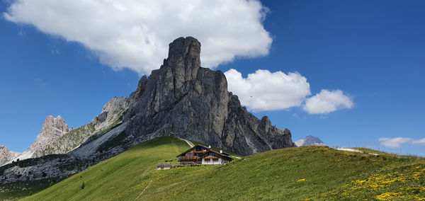 Low angle view of rocks on mountain against sky