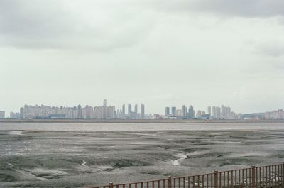 Buildings in city against sky