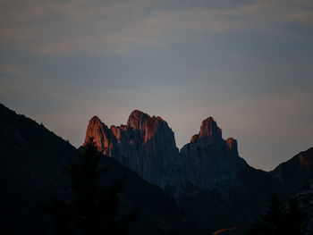 Scenic view of rocky mountains against sky during sunset