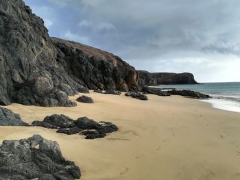 Scenic view of beach against sky