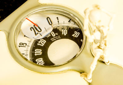 Close-up of clock on table