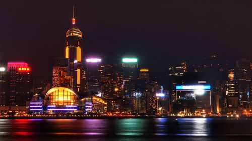 Illuminated buildings in city at night