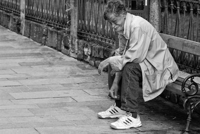 Side view of a person holding umbrella