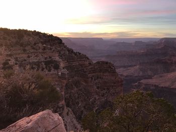 Scenic view of mountains against sky at sunset